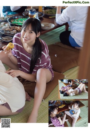 A woman in a green bikini sitting on the floor.