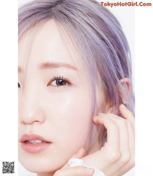 a close up of a person with purple hair