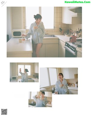 A woman standing in a kitchen holding a cup of coffee.