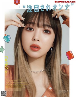 A magazine with a picture of a woman with long hair.